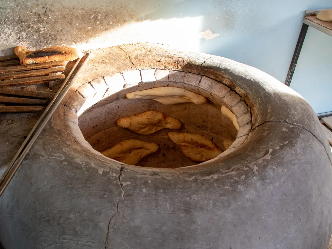 Baking bread in a clay oven in Badiauri